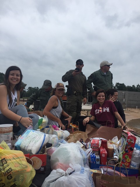  Volunteers and the Texas Rangers are transported along with food and supplies into areas land locked by flooding waters.